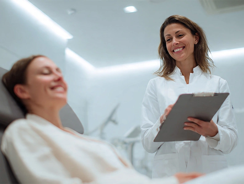 A clinician and patient discussing safe IV therapy care